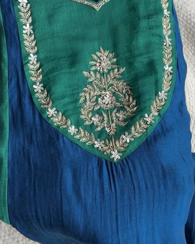 Home Close-up of a blue and green banarasi yoke with zari handwork